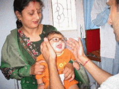 A child receives a pair of spectacles.